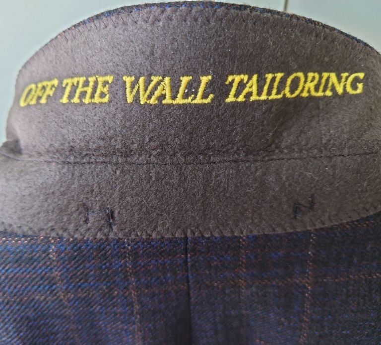 Under collar text Off the Wall Tailoring